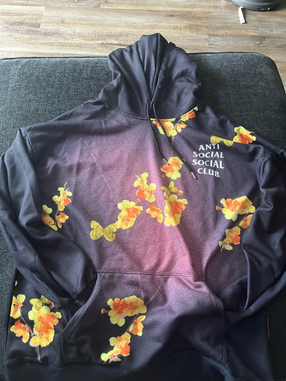 Anti Social Social Club Black Hoodie with Yellow and Orange Floral Accents
